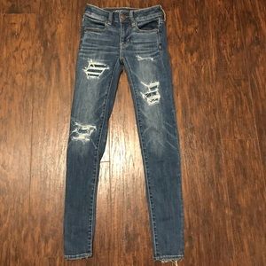 Ripped blue jeans only been worn once.